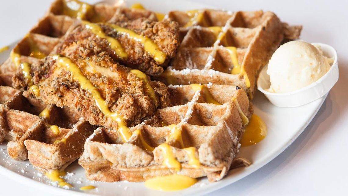 Dame's Chicken & Waffles signature dishes Braised Lamb Shank
Fish And Grits
Mother And Child Reunion